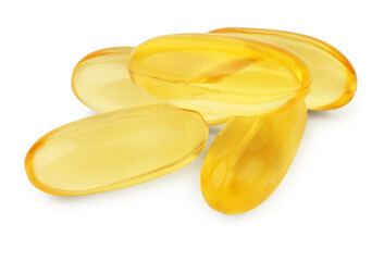 Many yellow vitamin capsules isolated on white