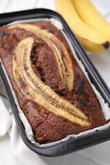 Delicious homemade banana bread on table, closeup