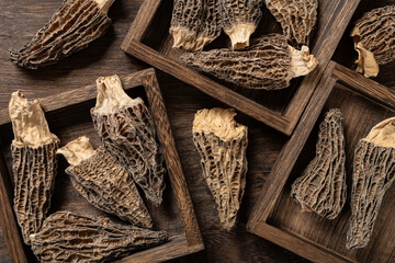 top view morel on wood trays at horizontal composition