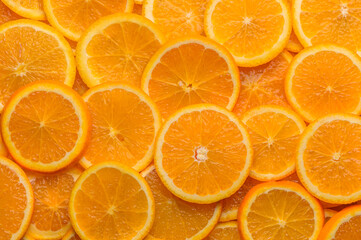 oranges cut into slices and laid out on the table as a food background 4