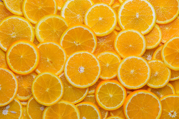 oranges cut into slices and laid out on the table as a food background 8