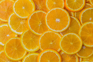 oranges cut into slices and laid out on the table as a food background 9