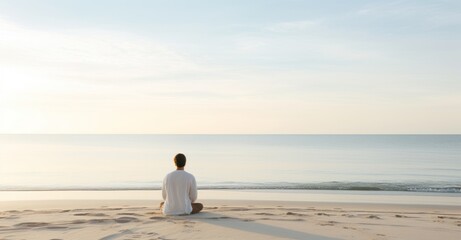 Mindful meditation on a serene beach at dawn, embracing tranquility.