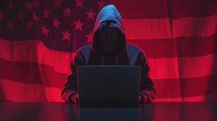 American hacker. USA flag near cyber criminal. Hacker in hoodie near laptop. Silhouette American cyber criminal. Hacker breaks into US government website. Creates computer viruses against the USA.