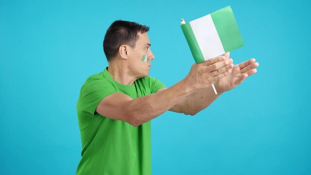 Man cheering for Nigeria, angry with the decision of referee