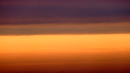 Naklejka na ściany i meble Sunset sky background. Panoramic view of the evening sky.