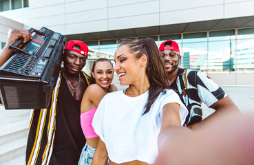 Group of hip hop dancers taking a break and shooting selfies