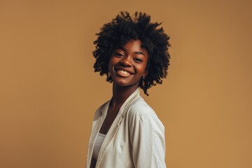 Fototapeta na wymiar Happy successful black business woman in studio portrait.
