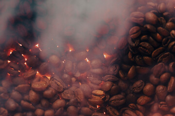 Roasted coffee beans with smoke and fire background. Close up
