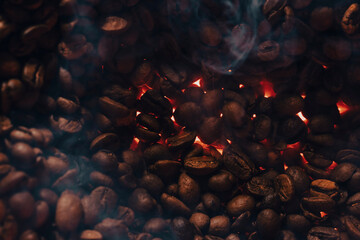 Roasted coffee beans with smoke and fire background. Close up