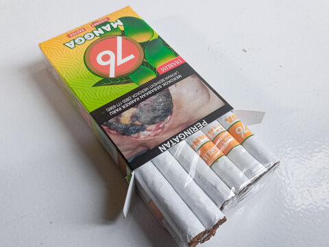 Djarum 76 Mangga Kretek up close. Packaged cigarettes. Djarum 76 mangga Kretek cigarettes on isolated background. Bandung-Indonesia,1-28-2024