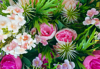 Obraz na płótnie Canvas Colorful flowers arrangement for background. Bouquets of beautiful flowers for decorative or weddings gift. 