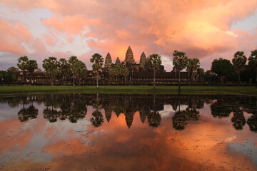 Panorama view of Angkor Wat Temple reflecting on Lake at Dawn (Siem Reap, Cambodia)