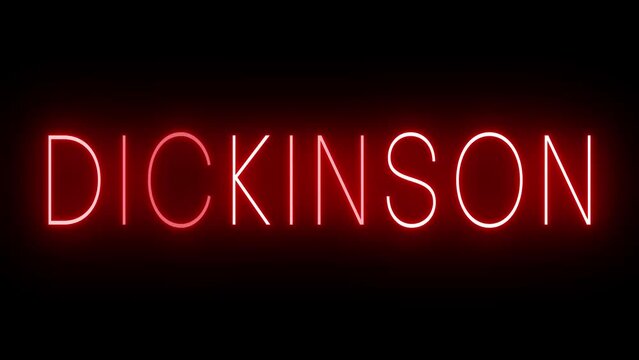 Flickering red retro style neon sign glowing against a black background for DICKINSON