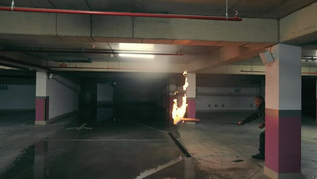 Fire Suppression System Test in Underground Parking, Testing of a fire suppression system with a sprinkler activation simulation in an underground parking area.