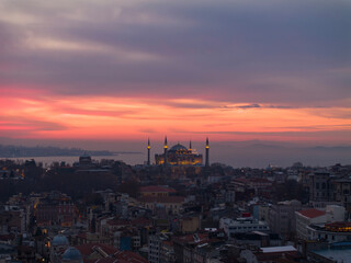Naklejka premium New Mosque (Yeni Cami) and Hagia Sophia (Ayasofya) Mosque in the Magnificent Sunrise Colorful Drone Photo, Eminonu Fatih, Istanbul Turkiye (Turkey)