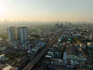 Aerial view of Bangkok downtown, Sky train railway, Cars on traffic road and buildings, Thailand.