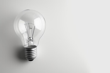A lone light bulb glows with potential on a stark white canvas, symbolizing the power of illumination and the simplicity of a single idea