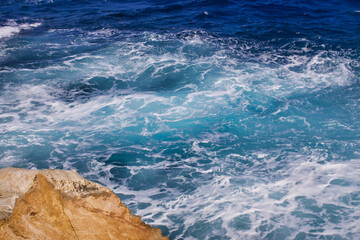 Beautiful Aegean Sea off the coast of Naxos, limestone rocks before the entering Zeus Bay 