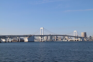 Fototapeta na wymiar Rainbow Bridge viewed from Toyosu in Tokyo, Japan