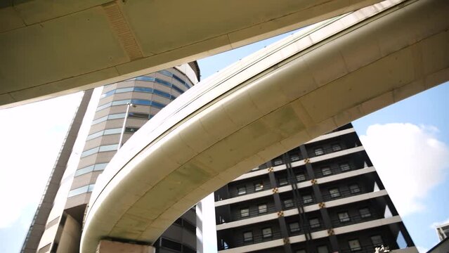 A highway passing through the TKP Gate Tower Building in Osaka, Japan. Freeway passing through a skyscraper. High quality 4k footage