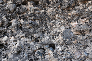 texture of a gray stone on a mountain in close-up