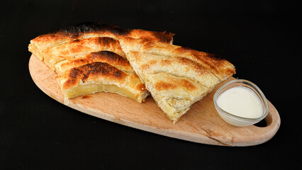 spinach pie on a black background