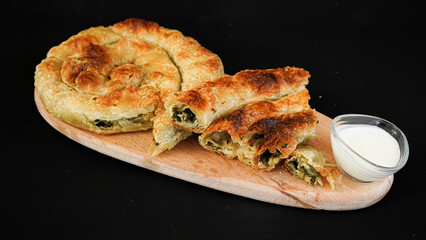 spinach pie on a black background