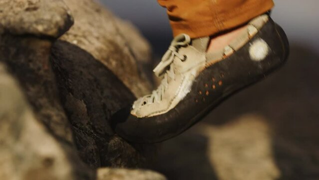Worn out shoes of professional rock climber
