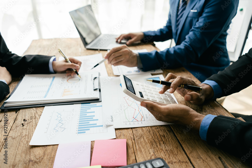 Aufkleber business people or accountant using calculator while working analytical business report on the workp