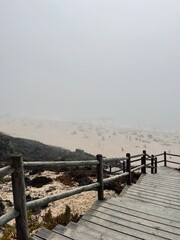Foggy ocean coast, sea beach in the fog