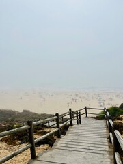 Fototapeta premium Foggy ocean coast, sea beach in the fog