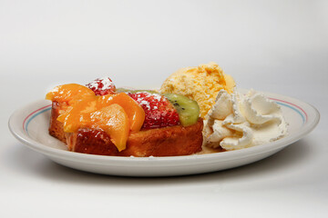 fruit tart with ice cream and cream