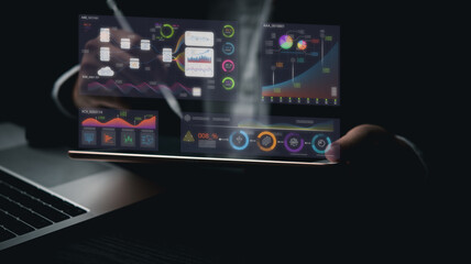 Business development and technology Data analyst for report marketing strategy planning. graph analysis and information on a futuristic virtual interface screen.