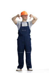 The builder, on a white background, in full height, shows his thumbs down