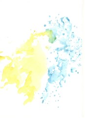 Yellow and blue watercolor paint stains on white papper 