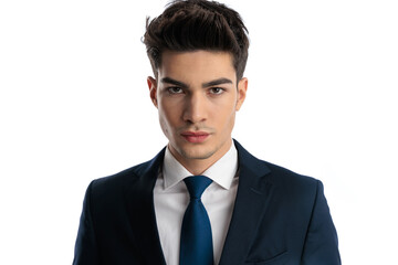 portrait of sexy elegant man in navy blue suit looking at camera
