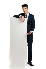 proud businessman showing and presenting empty board