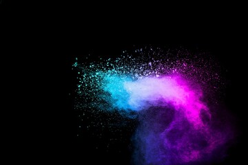 Explosion of blue pink colored powder isolated on black background.Pink blue dust splash.