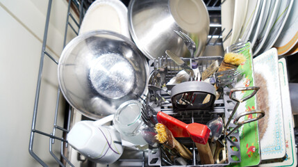 cutlery and glasses and plates cleaned in the dishwasher, household