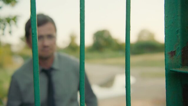 A man jumps the gate.