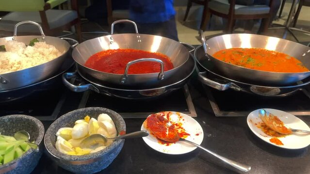 All you can eat buffet restaurant. Asian cuisine food bar at a hotel buffet. Resort restaurant lunch and dinner food buffet.