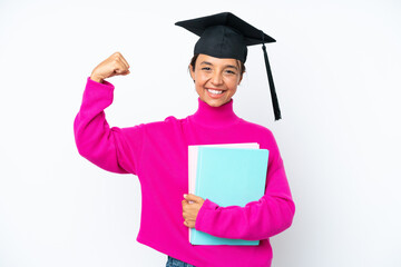 Young student hispanic woman holding a books isolated on white background doing strong gesture