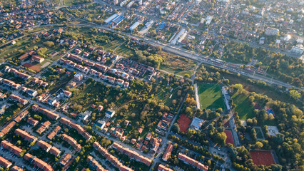 Aerial view of suburban houses in new modern development area. Small city on aerial view. Scenic...