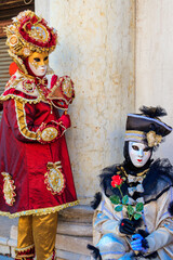 Fototapeta na wymiar Two venetian masks during the annual Venice Carnival in Venice, Italy