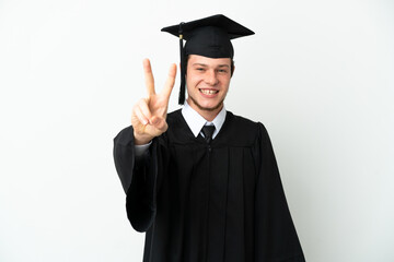 Young university Russian graduate isolated on white background smiling and showing victory sign