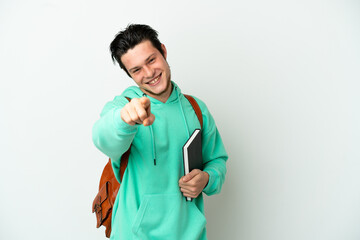 Young student man isolated on white background pointing front with happy expression