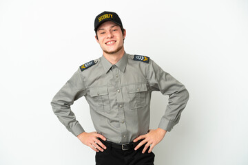 Young Russian security man isolated on white background posing with arms at hip and smiling