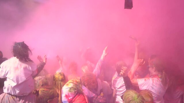 People celebrating holi festival with colors. Holi is a festival of India. 