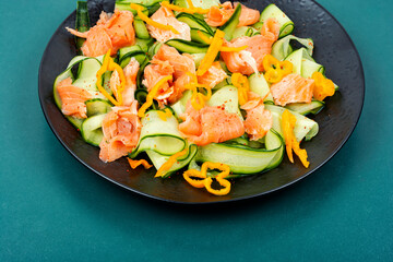 Homemade fish salad with raw cucumber.
